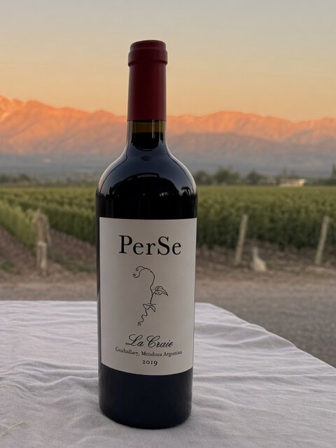 A bottle of red wine with its label, on a restaurant table