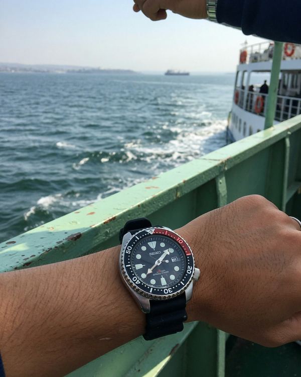 A dive watch on a wrist